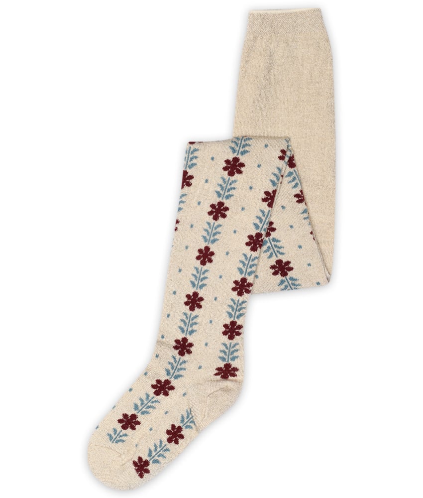 Utrolig søt strømpebukse i glitter fra mp Denmark med blomstermønster. Laget av 50% ull, 28% polyester, 18% polyamid og 4% elastan. Danske mp er kjent for sitt design, gode passform og kvalitet. Vaskes på ullprogram i vaskemaskinen med vaskemiddel for ull/silke. Sertifisert med Standard 100 fra OEKO-TEX®.